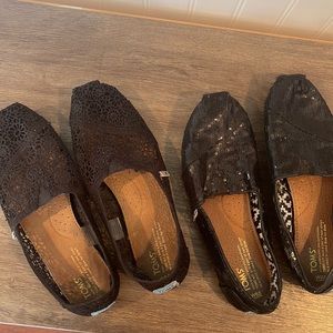 2 pairs of black TOMS slip on shoes